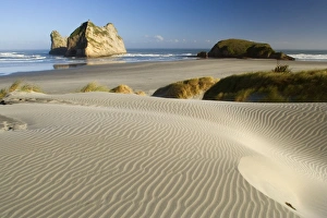 Wharariki Beach - white sand dunes of Whaririki Beach Wharariki Beach - white sand dunes of Whaririki Beach