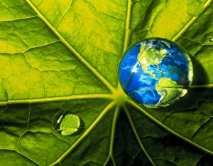 Abstract art of Earth & water drop on a leaf Abstract art of Earth & water drop on a leaf