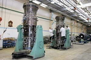 Prints of Aircraft engine construction. Engineers assembling aircraft gas turbine engines. One engine is at left, one at centre, and another at far right Images Dated 2006 July: Aircraft Engine Construction Print