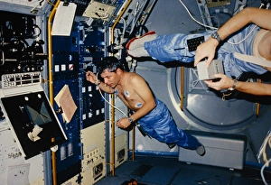 Astronaut demonstrating weightlessness on shuttle Astronaut demonstrating weightlessness on shuttle