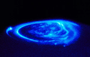 Prints of Aurorae on Jupiter. Coloured ultraviolet Hubble Space Telescope (HST) image of aurorae (light blue) at the north pole of Jupiter Images Dated 2001 May: Jupiter Aurorae Print