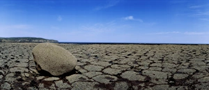 Boulder on a coastal wave-cut platform at low tide Boulder on a coastal wave-cut platform at low tide