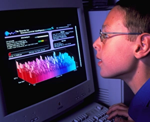 Boy at computer displaying SETI@home screen saver Boy at computer displaying SETI@home screen saver