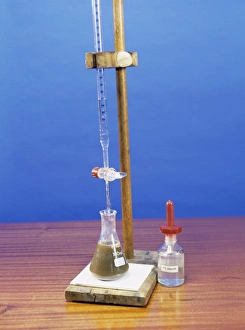 Prints of Brass analysis. Image 6 of 7. Performing a titration to determine the percentage of copper in brass. This requires titration of iodine with sodium thiosulphate as the reagent Images Dated 2004 November: Brass Analysis Print, Image 6 of 7