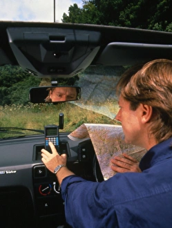 Car driver using hand-held GPS receiver Car driver using hand-held GPS receiver