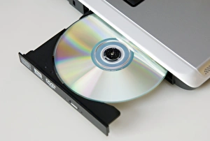 Prints of DVD (digital versatile disc) drive on a laptop computer Images Dated 2008 November: Laptop CD drive Print