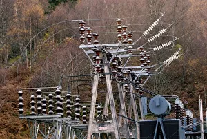 Prints of Ceramic insulators and voltage switching gear at an electricity substation. Photographed at Loch Tummel hydroelectric power station, Perthshire, Scotland, UK Images Dated 2008 May: Ceramic Insulators Print
