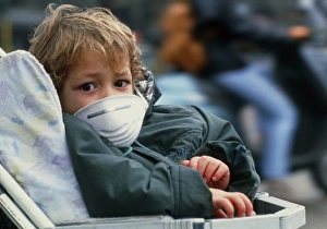 Child in buggy with air pollution face mask Child in buggy with air pollution face mask