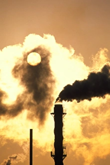 Chimney smoke from a chemical plant obscuring Sun Chimney smoke from a chemical plant obscuring Sun