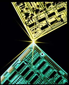 Two circuit boards meeting at a spot of light Two circuit boards meeting at a spot of light
