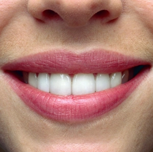 Close-up of a womans mouth showing healthy teeth Close-up of a womans mouth showing healthy teeth
