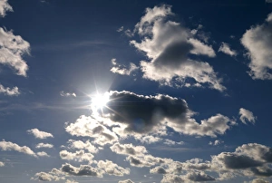 Clouds passing across the Sun Print