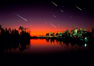 Composite image of meteors over a city at night Composite image of meteors over a city at night