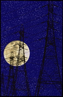 Computer image of a full moon and pylons Computer image of a full moon and pylons