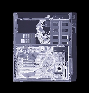 Prints of Computer. Simulated X-ray of a vertical processing unit of a computer. The front of the unit (right) contains removable disc drives for data storage Images Dated 2004 January: Computer Internal Components Print