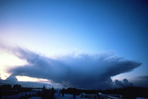 Cumulonimbus anvil cloud seen approaching town Cumulonimbus anvil cloud seen approaching town