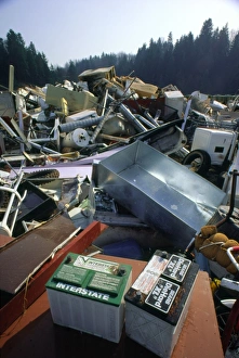 Discarded car batteries in a scrap metal pile Discarded car batteries in a scrap metal pile