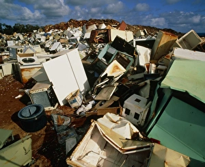 Discarded metal goods in a landfill site Discarded metal goods in a landfill site