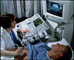 Doppler ultrasound scanning of a mans abdomen Doppler ultrasound scanning of a mans abdomen