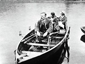 E. Rutherford with his wife and daughter in a boat E. Rutherford with his wife and daughter in a boat