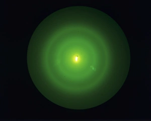 Prints of Electron diffraction pattern. Demonstration of wave-particle duality. An electron gun has been fired at a thin sheet of graphite Images Dated 2005 August: Electron diffraction pattern Print
