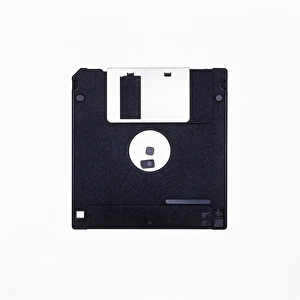 Prints of Floppy disk of 3.5 inch size enclosed in a plastic protective jacket. This flexible magnetic disk is used to store computer data Images Dated 2004 August: 3.5 Inch Floppy Disk Print in Protective Jacket