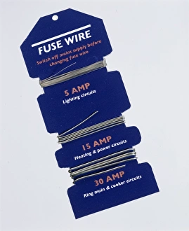 Prints of Fuse wires. Three different strengths of fuse wire wrapped around a cardboard holder. The different strengths are for use in different types of electrical circuit in the home Images Dated 2004 September: Fuse Wire Print: Three Ampere Fuses of Varying Thickness