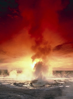 Geyser steaming at sunset, Yellowstone Park Geyser steaming at sunset, Yellowstone Park