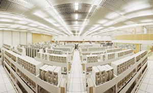 Prints of Grid supercomputers. Fish-eye lens view of a room packed with computers, forming a PC farm with immense processing power Images Dated 2003 September: Grid Computer Farm Print: A Fish-eye View of CERN's PC Cluster