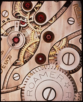 Internal cogs and gears of a 17-jewel Swiss watch Internal cogs and gears of a 17-jewel Swiss watch