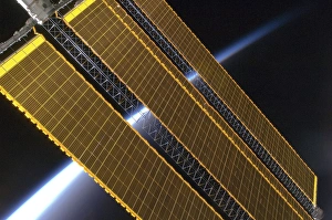 Prints of ISS solar array. Airglow above the Earths horizon seen behind an array of solar panels on the International Space Station. Image taken by an Expedition 17 crewmember on 4th August 2008 Images Dated 2010 June: International Space Station Solar Array Print