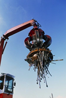 Large electromagnet in use at a scrapyard Large electromagnet in use at a scrapyard