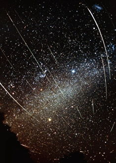 Prints of Leonid meteors. Optical time-exposure image of Leonid meteors (streaks) against a starfield containing the Milky Way (band across centre) Images Dated 2002 April: Leonid Meteor Print
