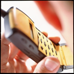Man holding a mobile telephone to his ear Man holding a mobile telephone to his ear