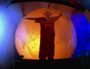 Man silhouetted in the virtual reality cybersphere Man silhouetted in the virtual reality cybersphere