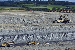 Opencast coal mine Print: Excavator extracting coal