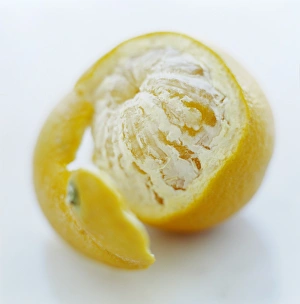 Prints of Half-peeled orange (Citrus sinensis). This is rich in vitamin C, needed for healthy skin and gums Images Dated 2003 May: Orange Half-peeled Print, a photograph of a sliced citrus fruit