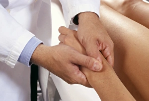 Prints of Osteopathy. Osteopath manipulating a patients hand, using a thrust articular technique Images Dated 2004 February: Osteopathy Print: A Practitioner Using Thrust Articular Technique