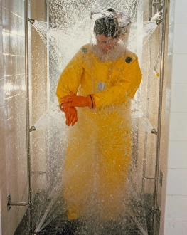 Pharmaceutical worker in isolation suit shower Pharmaceutical worker in isolation suit shower