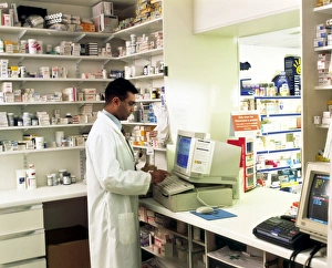 Images Dated 2nd September 2003: Pharmacist Using a Computer Print