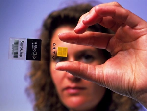 Researcher holds DNA SeroChip for medical tests Researcher holds DNA SeroChip for medical tests