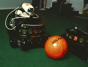 Two robots go for a ball at RoboCup-98 in Paris Two robots go for a ball at RoboCup-98 in Paris