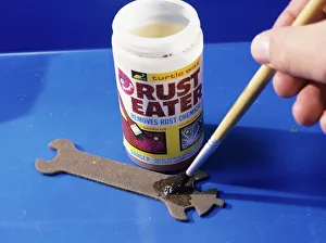 Images Dated 2004: Rust Treatment Print: Brush Applying Chemicals to a Rusty Spanner