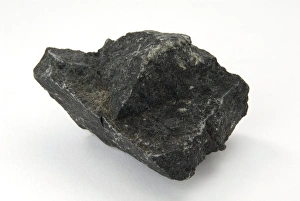 Prints of Sample of basalt. Basalt is an extrusive (volcanic) igneous rock composed of calcic plagioclase feldspar, pyroxine, and occasionally olivine. Accessory minerals are sometimes visible Images Dated 2009 July: Basalt Print