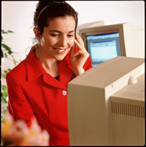 Secretary working at an office computer Secretary working at an office computer