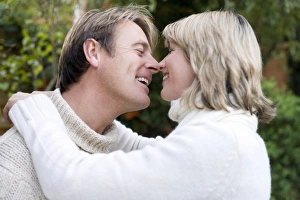 Couple Embracing Prints: Smiling couple embracing