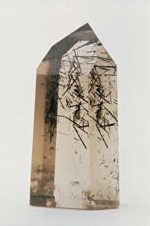 Smoky quartz crystal with tourmaline inclusions Smoky quartz crystal with tourmaline inclusions