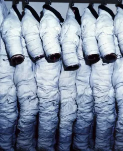 Astronaut Prints: Space Suits Print: Row of EMUs Hanging from Hooks