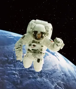 Prints of Spacewalk. Composite image of an astronaut floating free during a spacewalk against a backdrop of cloud systems on Earth. A spacewalk is also known as ExtraVehicular Activity (EVA) Space Prints: Astronaut in Spacewalk Print