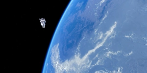 Space Shuttle Prints: Spacewalk Print: Astronaut in a Manned Maneuvering Unit above the Earth